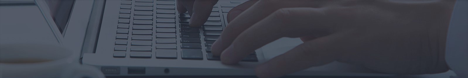 Fingers on keyboard of freelance graphic designer creating amazing graphic designs in capalaba